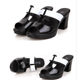 Black and white slipper sandals